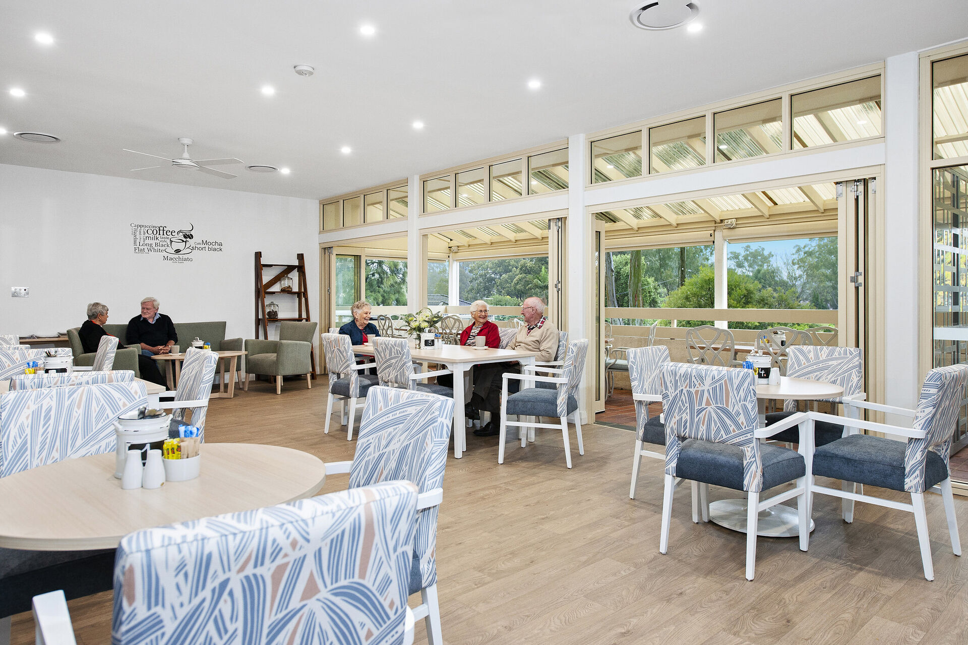 retirement village community centre with tables and chairs for residents socialising at baptistcare aminya village in baulkham hills enabling over 55s to downsize