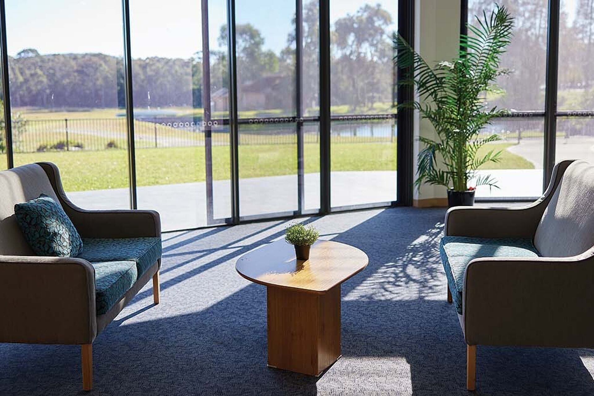 aged care resident sitting area natural sunlight baptistcare bethshan gardens centre aged care home in wyee nsw lake macquarie