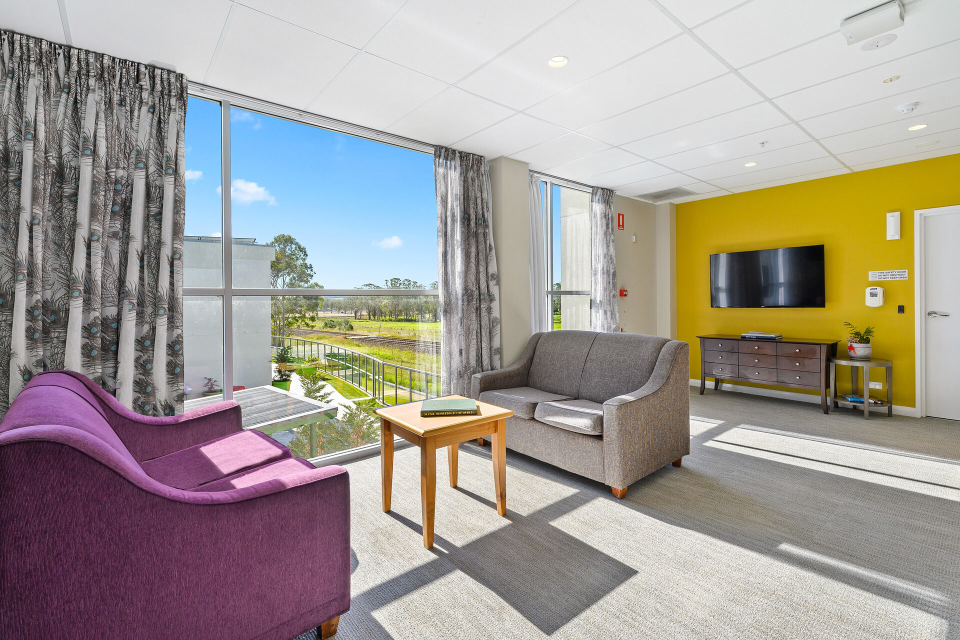 communal indoor sitting area for nursing home residents at baptistcare durham green centre aged care home in menangle nsw
