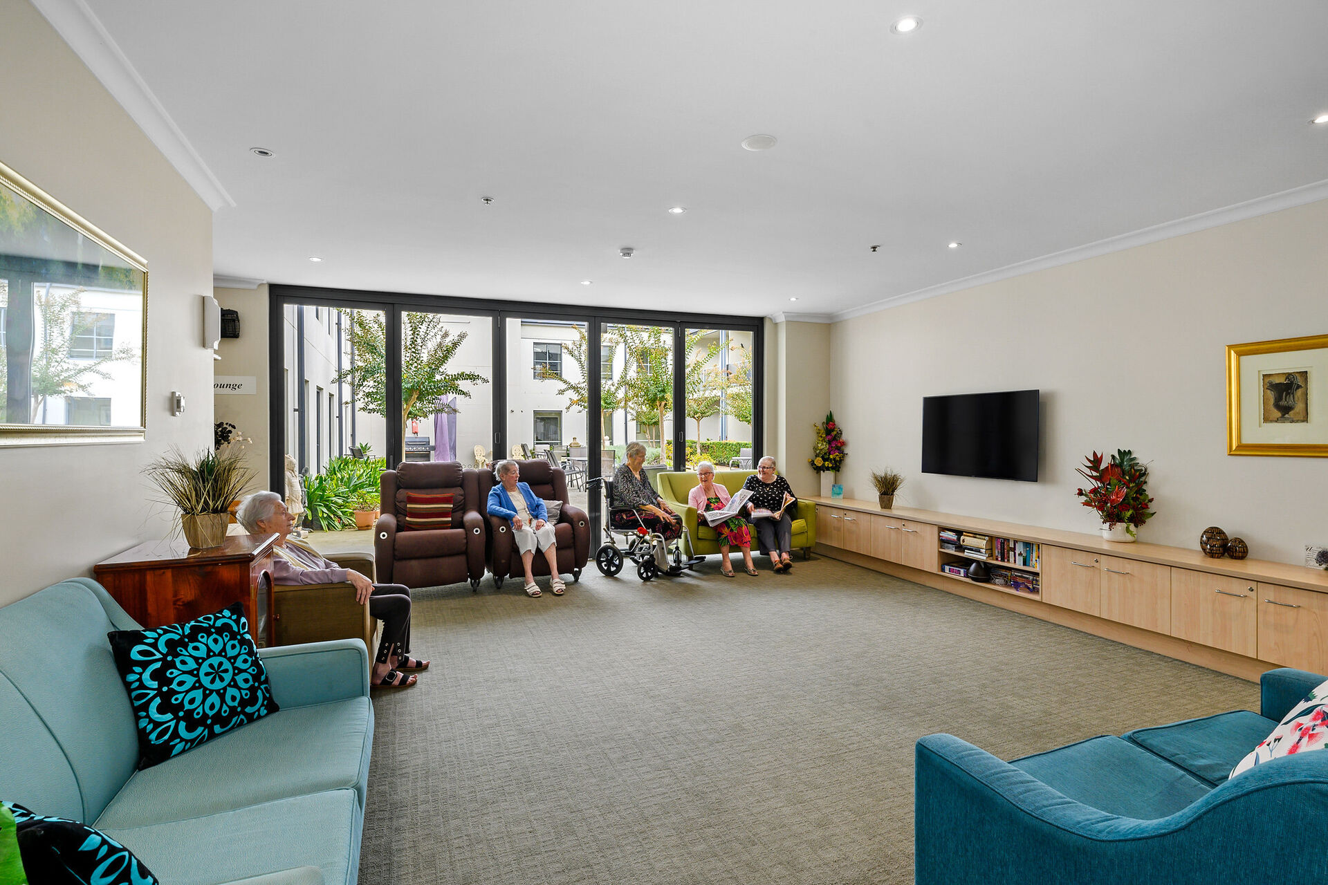 communal spacious lounge room for nursing home residents at baptistcare durham green centre aged care home in menangle nsw