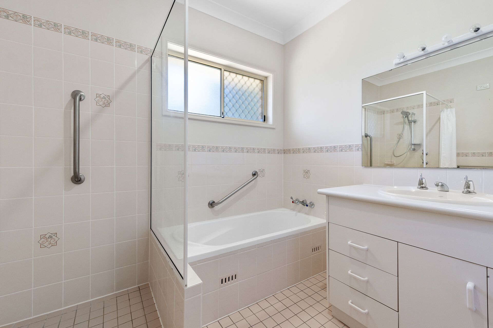 bathroom with large shower and bath in a 2 bedroom home at the over 55s baptistcare All Saints retirement village in New Lambton Newcastle