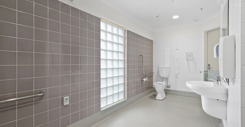 large ensuite bathroom for three elderly aged care residents including dementia care in baptistcare aminya centre residential aged care home