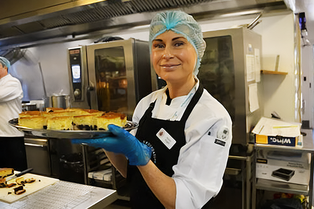 Woman holding tray of food