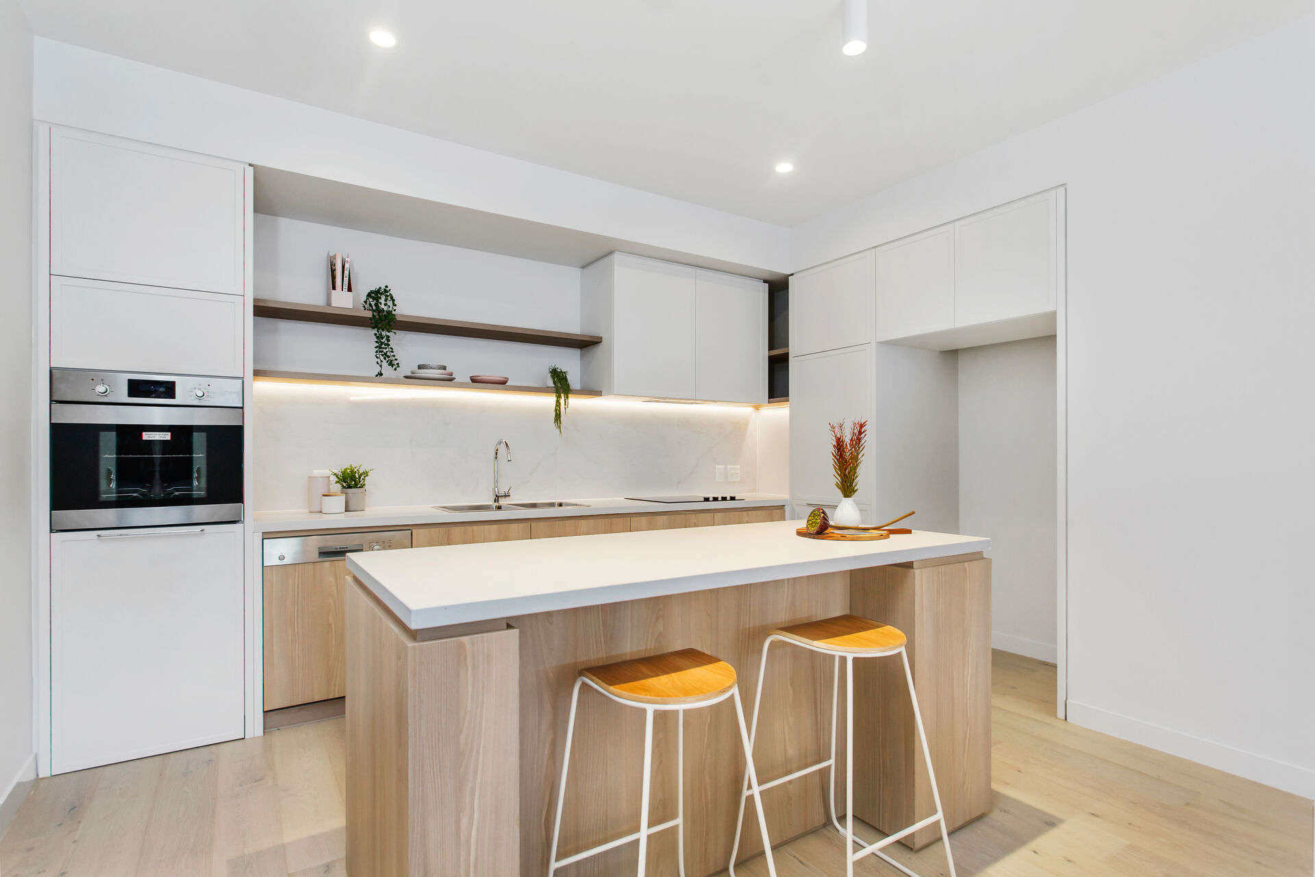 modern kitchen with island bench and storage at baptistcare gracewood retirement village in kellyville hills district