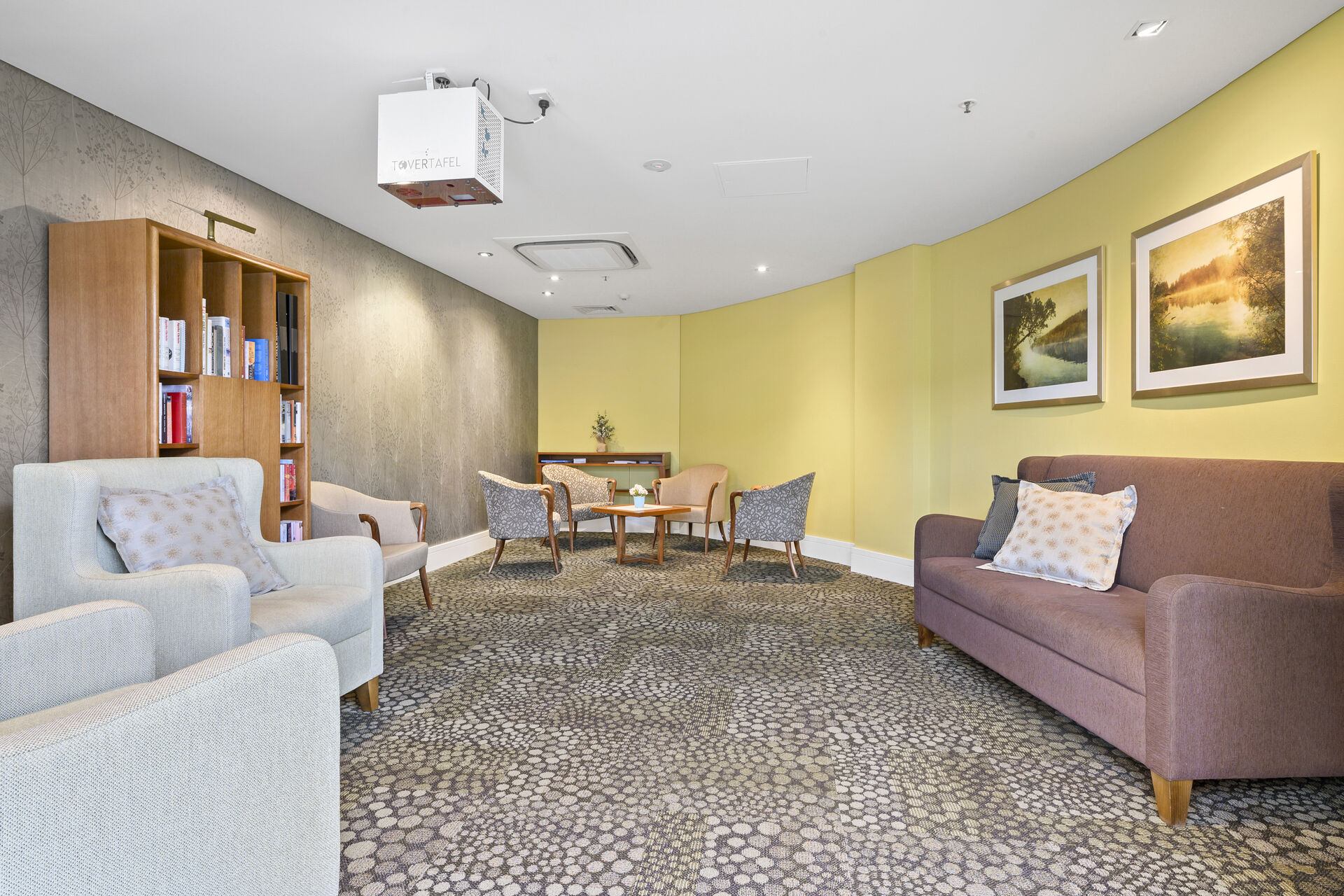 inviting lounge with large chairs for the aged care residents of baptistcare griffith residential aged care home nursing home