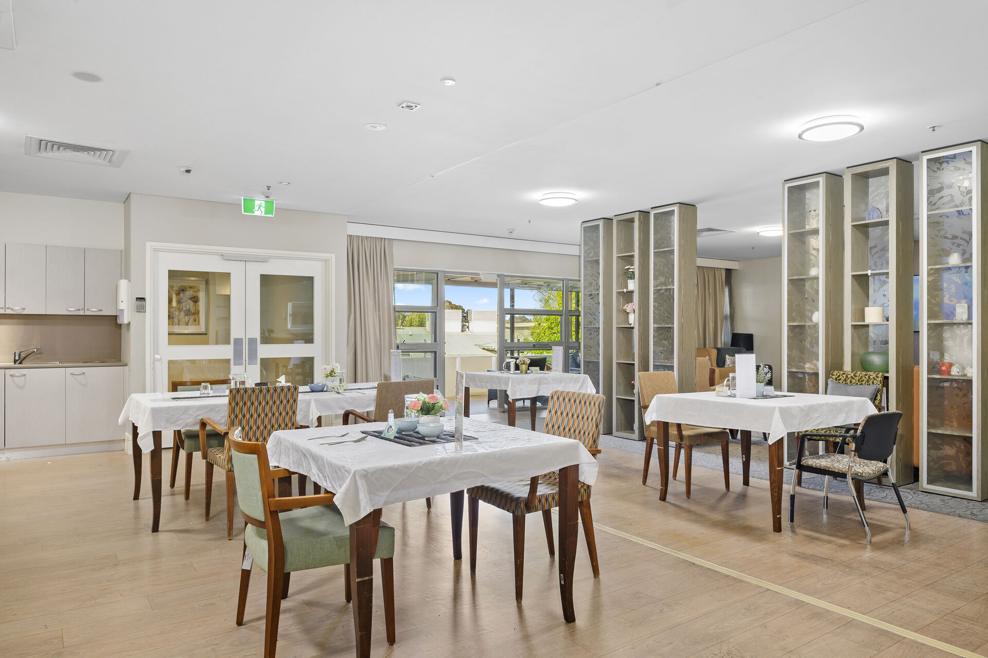spacious dining room for the aged care residents of baptistcare griffith residential aged care home nursing home