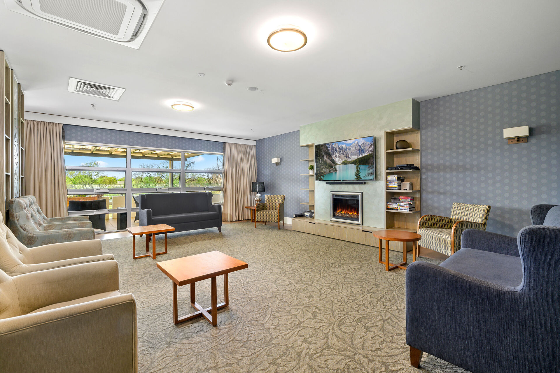 lounge room with fireplace area for nursing home residents to enjoy at baptistcare griffith residential aged care home