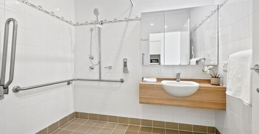 ensuite bathroom for spacious presidential suite single room for elderly aged care resident including dementia care in baptistcare blue hills residential aged care home in prestons