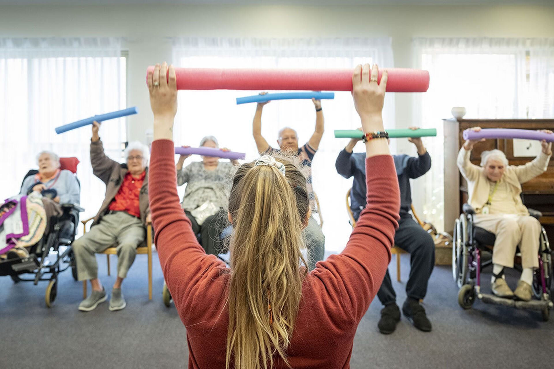 a nursing home group of residents exercising at baptistcare gracehaven aged care home in rockingham wa