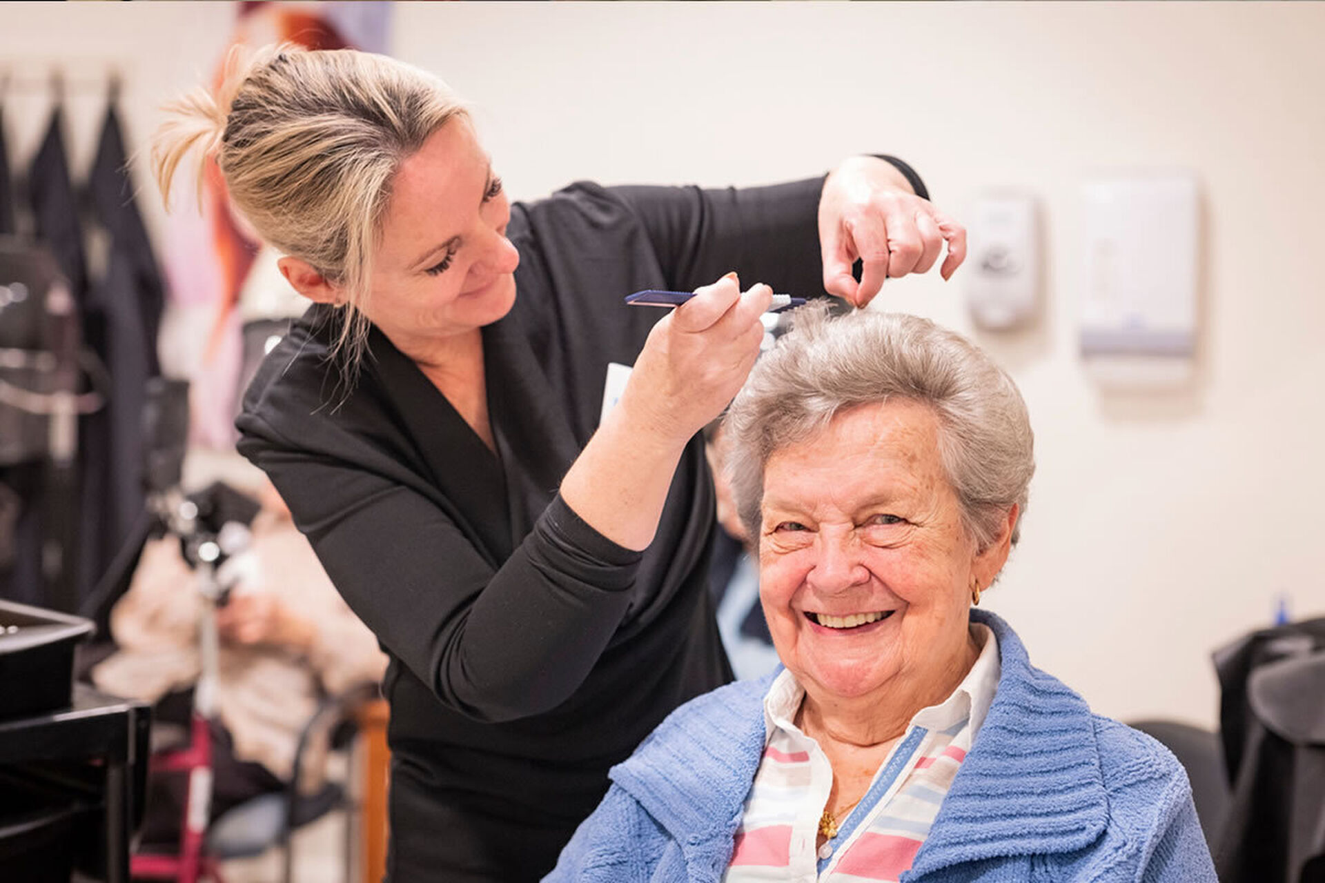 a nursing home resident at the hair dresser at baptistcare gracewood aged care home in salter point wa