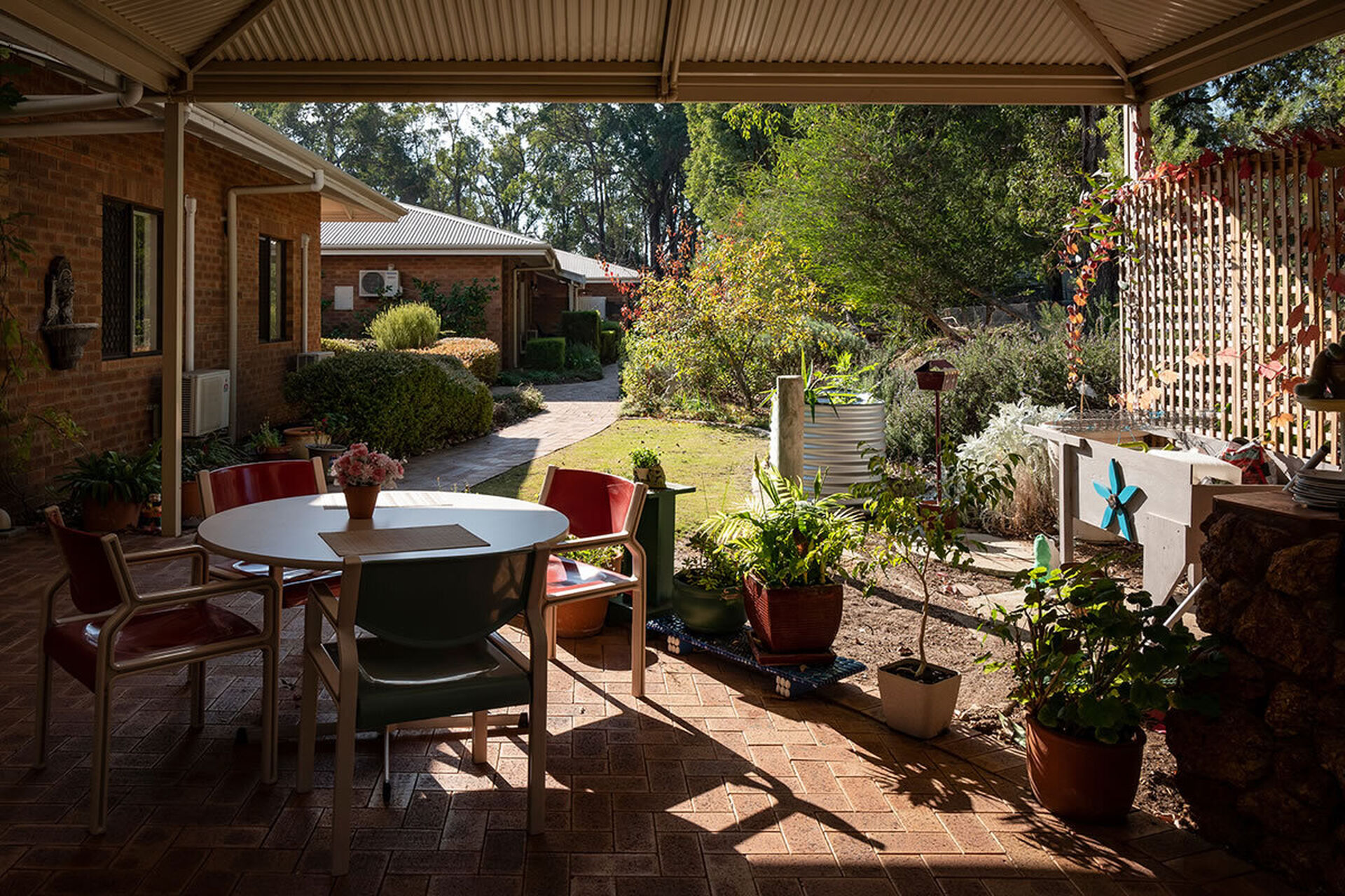 modern garden and outdoor sitting area for nursing home residents to enjoy at baptistcare yallambee aged care home in mundaring wa