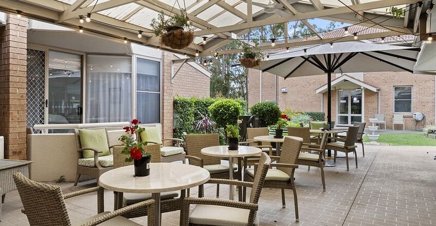 outdoor sitting area with pergola for elderly aged care resident including in baptistcare dorothy henderson lodge macquarie park nsw northern sydney residential aged care home