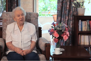 elderly aged care home resident in her room at baptistcare carey gardens nursing home