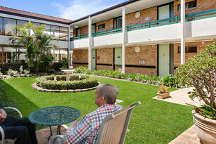 two residential aged care residents socialising in the gardens of baptistcare aminya centre aged care home