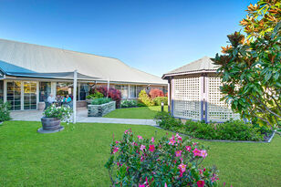 gardens and outdoor sitting area for aged care residents at baptistcare kularoo aged care home in forster nsw