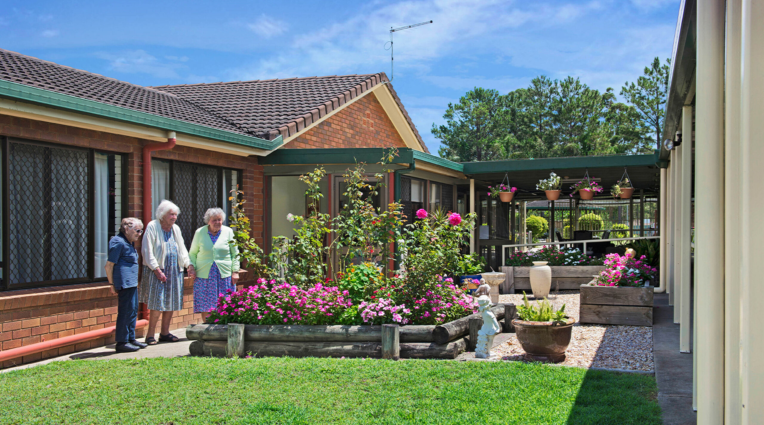 aged care home residents enjoying time in the gardens at baptistcare mid richmond centre residential aged care home in coraki nsw far north coast