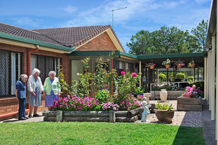 nursing home residents enjoying time in the gardens at baptistcare mid richmond centre residential aged care home in coraki nsw far north coast