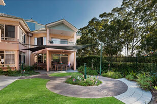 two story aged nursing home with a footpath for aged care residents to walk around to enjoy the gardens at baptistcare warabrook centre aged care home in warabrook newcastle nsw