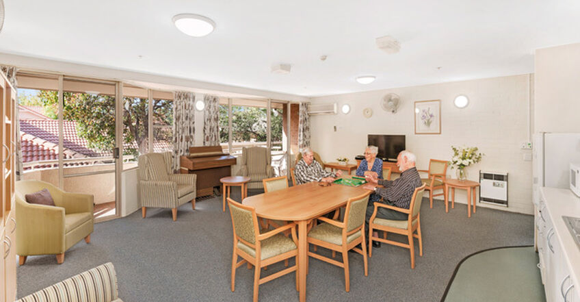 communal sitting area for games and socialising for elderly aged care residents in baptistcare dorothy henderson lodge macquarie park nsw northern sydney residential aged care home