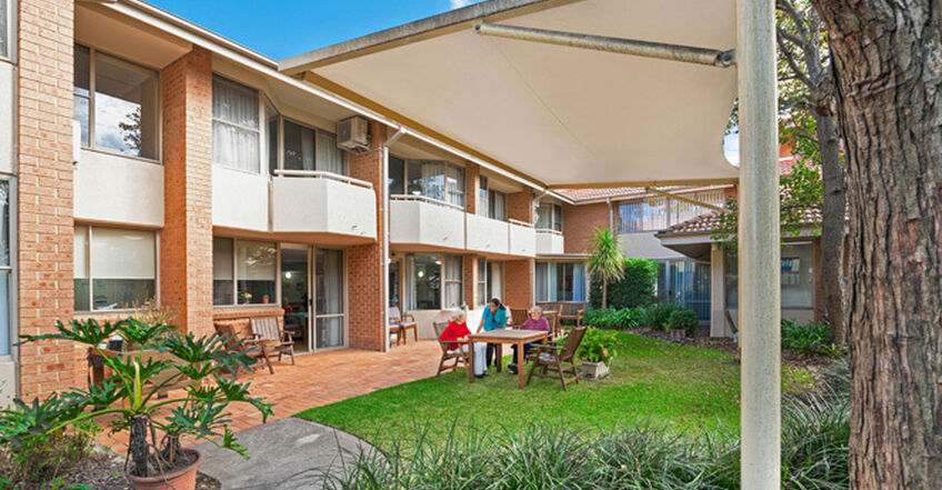 outdoor sitting area with pergola for elderly aged care resident including in baptistcare dorothy henderson lodge macquarie park nsw northern sydney residential aged care home
