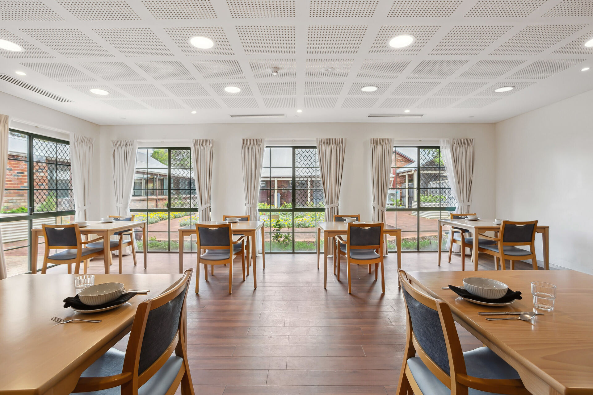 modern communal dining room for nursing home residents to be served fresh meals at baptistcare william carey court aged care home in busselton wa