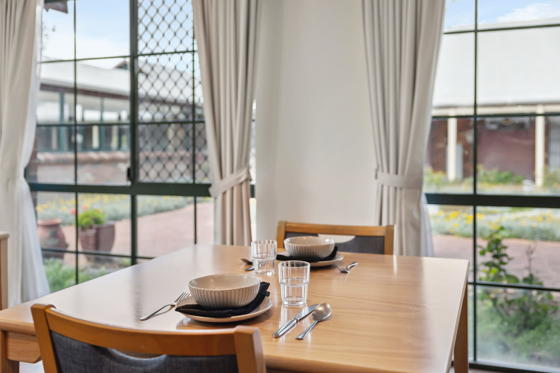 modern communal dining room for nursing home residents to be served fresh meals at baptistcare william carey court aged care home in busselton wa