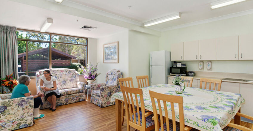 dining room with tables and chairs for nursing home residents at baptistcare aminya centre residential aged care home