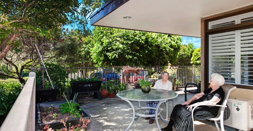 outdoor covered verandah overlooking beautiful gardens for elderly aged care residents to enjoy at baptistcare aminya centre residential aged care home