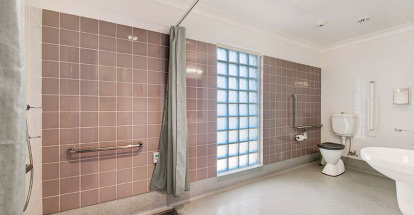 large ensuite bathroom for three elderly aged care residents including dementia care in baptistcare aminya centre residential aged care home