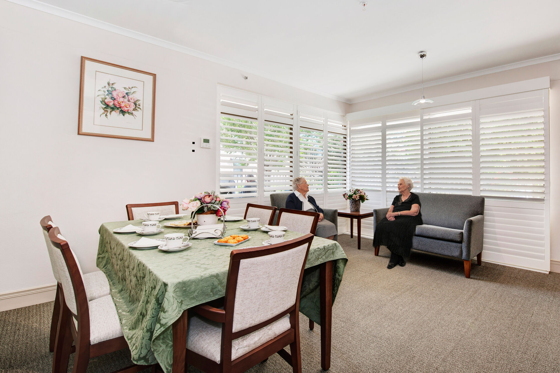 modern dining room with natural light at baptistcare aminya centre aged care home in baulkham hills