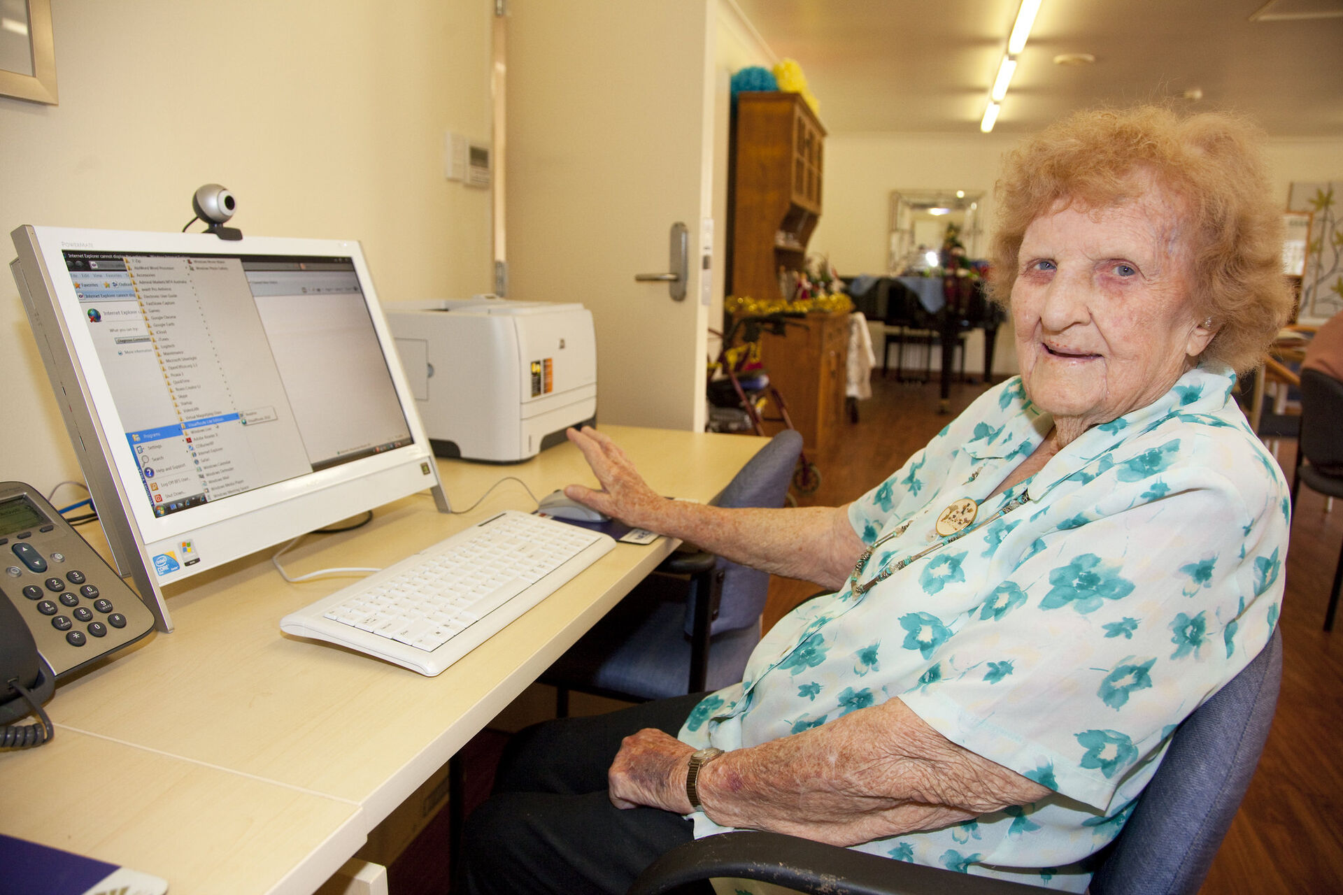 an aged care resident catching up on her emails on a computer at baptistcare maranoa centre aged care home in alstonville nsw far north coast