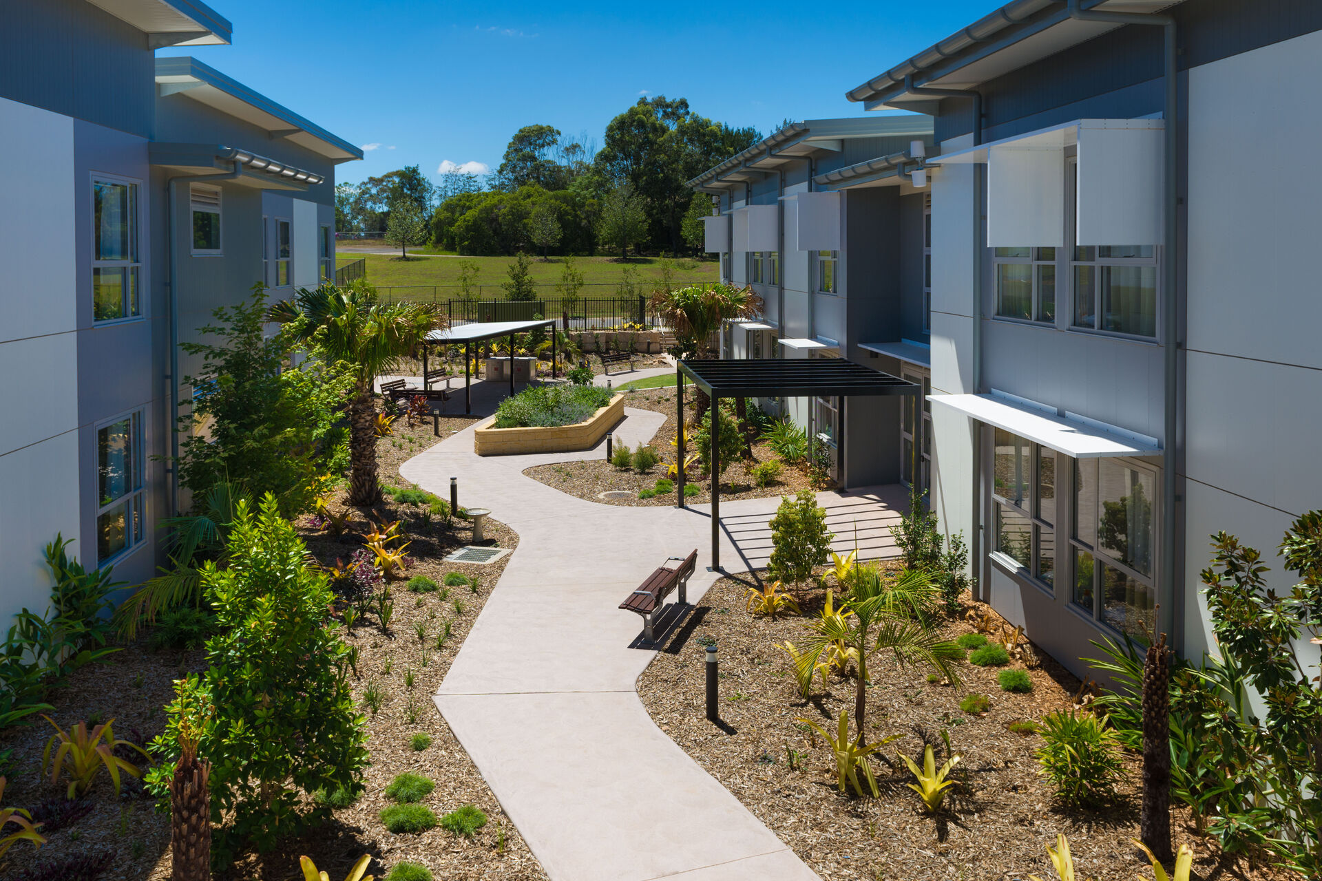 a footpath for aged care residents to walk through a well kept garden at the gracewood aged care home in kellyville hills district