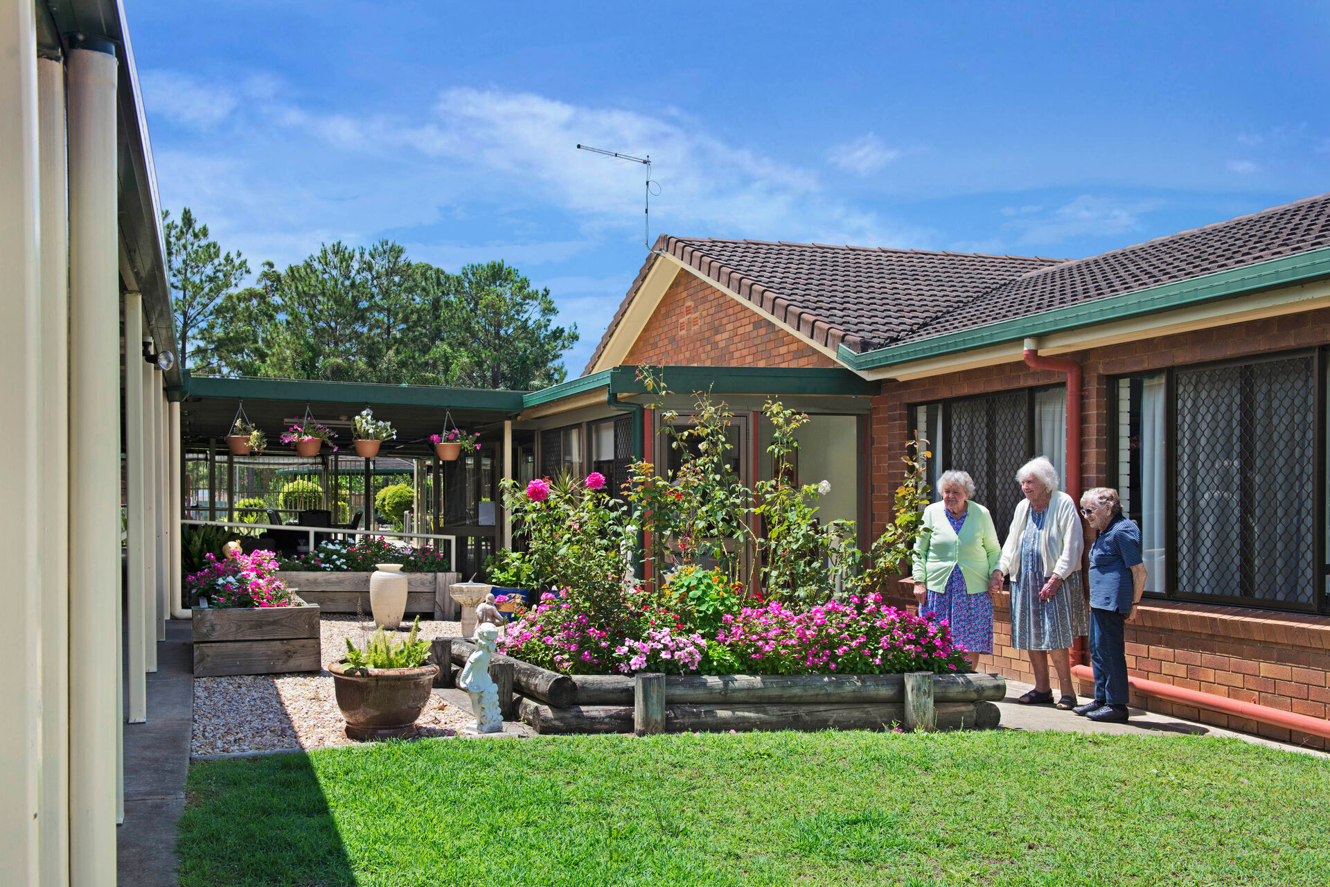 aged care home residents enjoying time in the gardens at baptistcare mid richmond centre residential aged care facility in coraki nsw far north coast