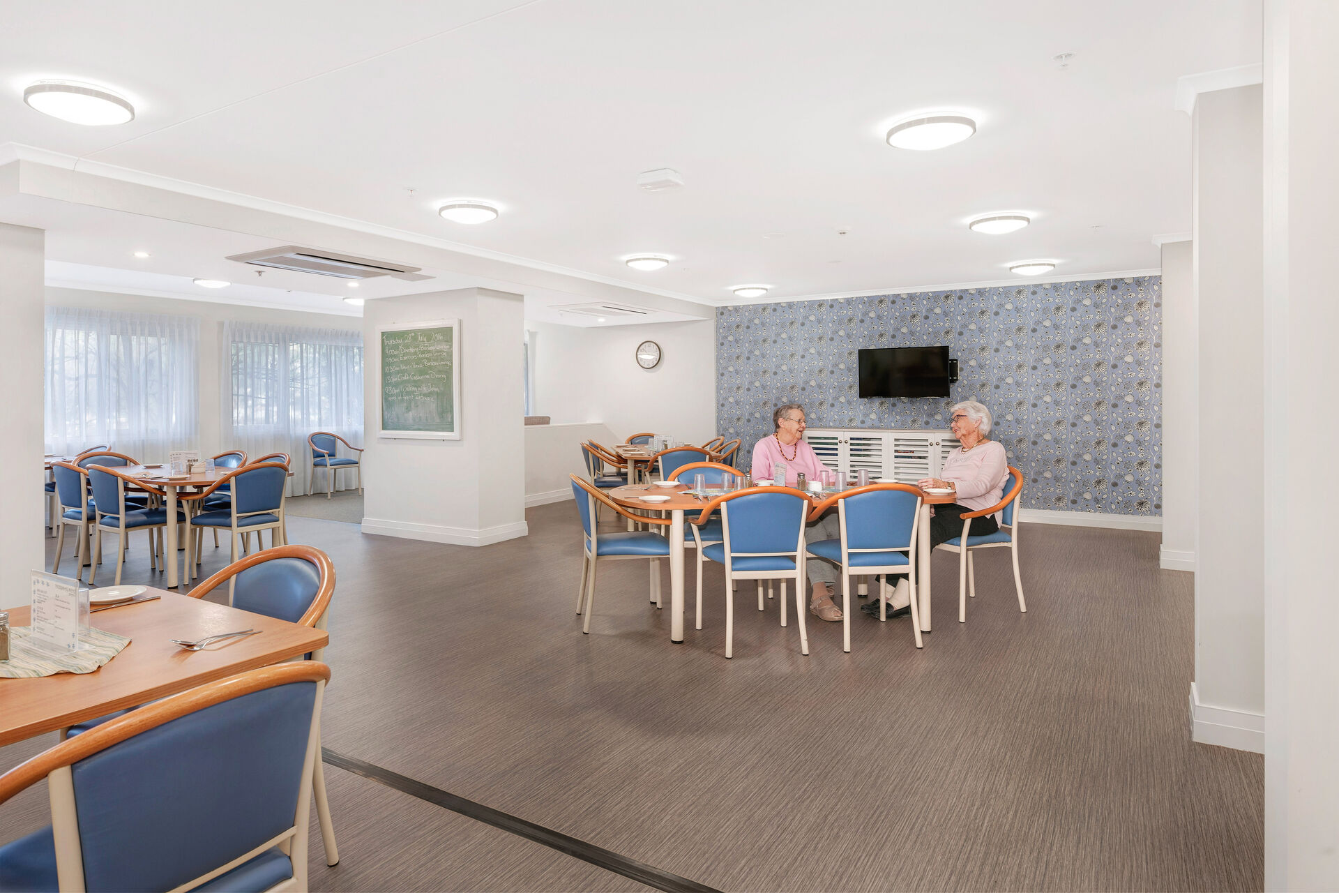 communal dining room for aged care residents to be served fresh meals at baptistcare orana centre aged care home in point clare nsw central coast