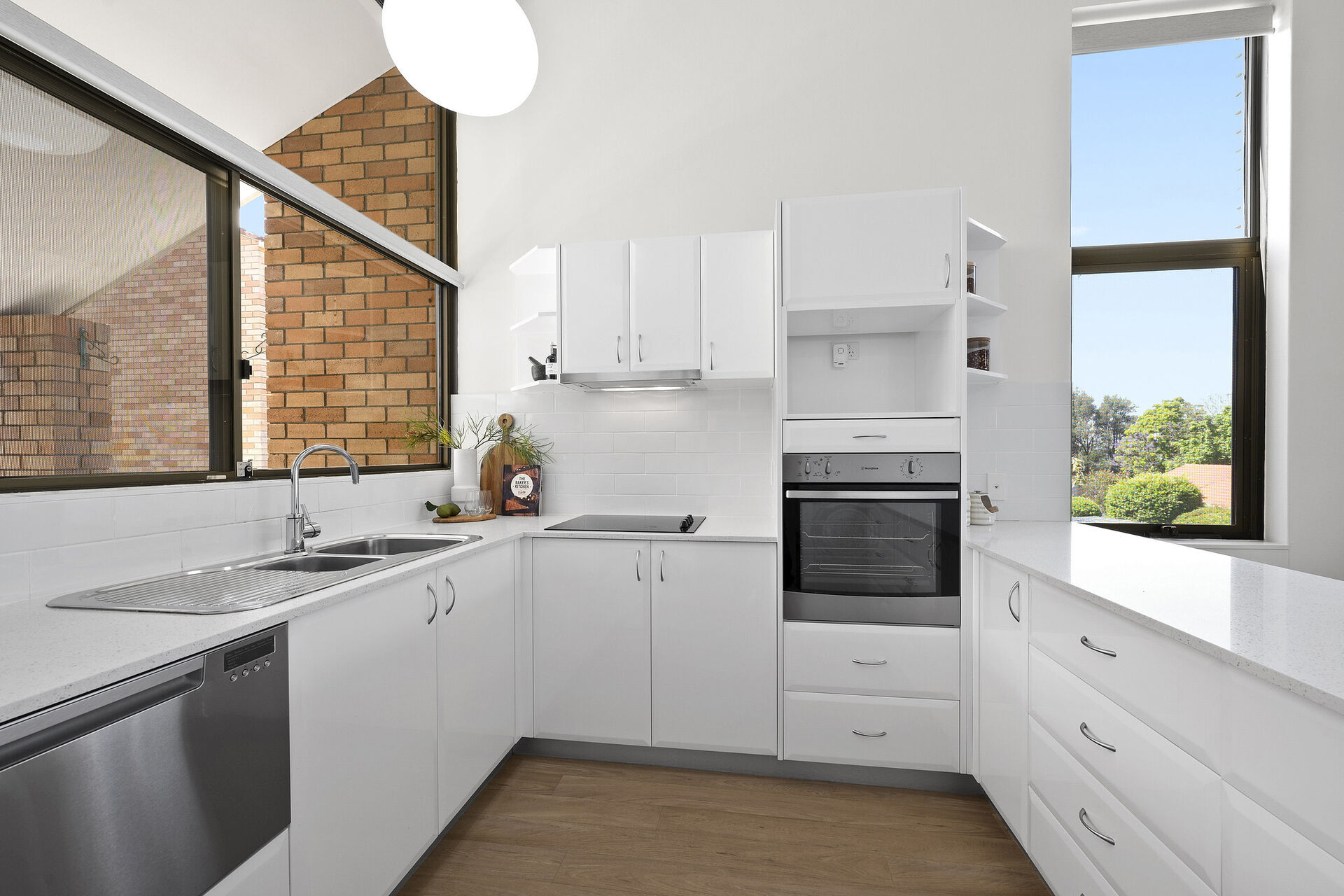 large modern kitchen with natural light in retirement village apartment baptistcare aminya village in baulkham hills enabling over 55s to downsize