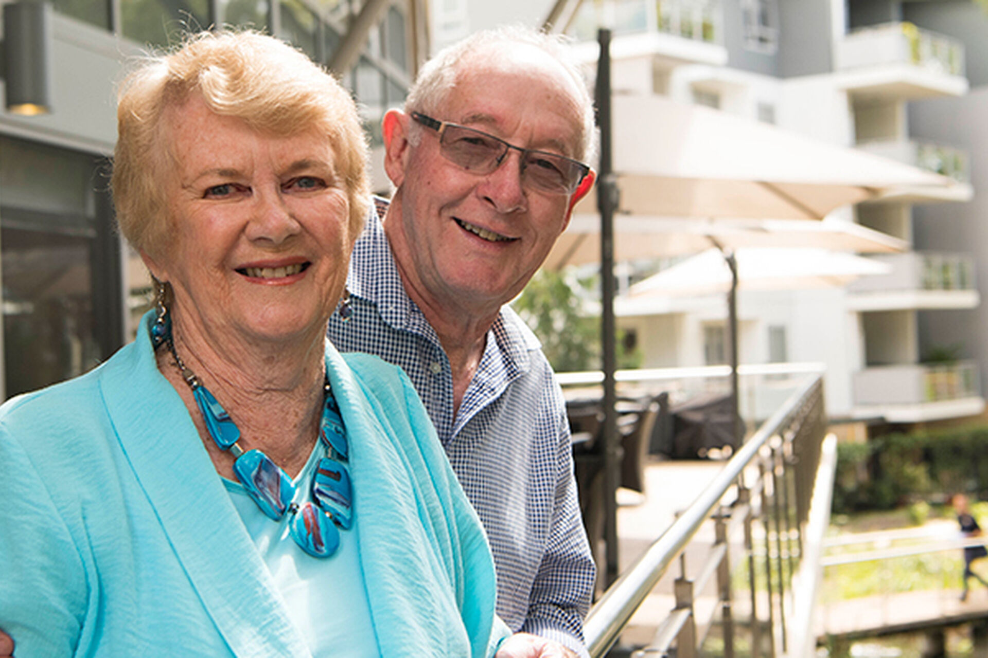 over 55s couple enjoying their balcony overlooking the gardebs at baptistcare gracewood retirement village in kellyville hills district