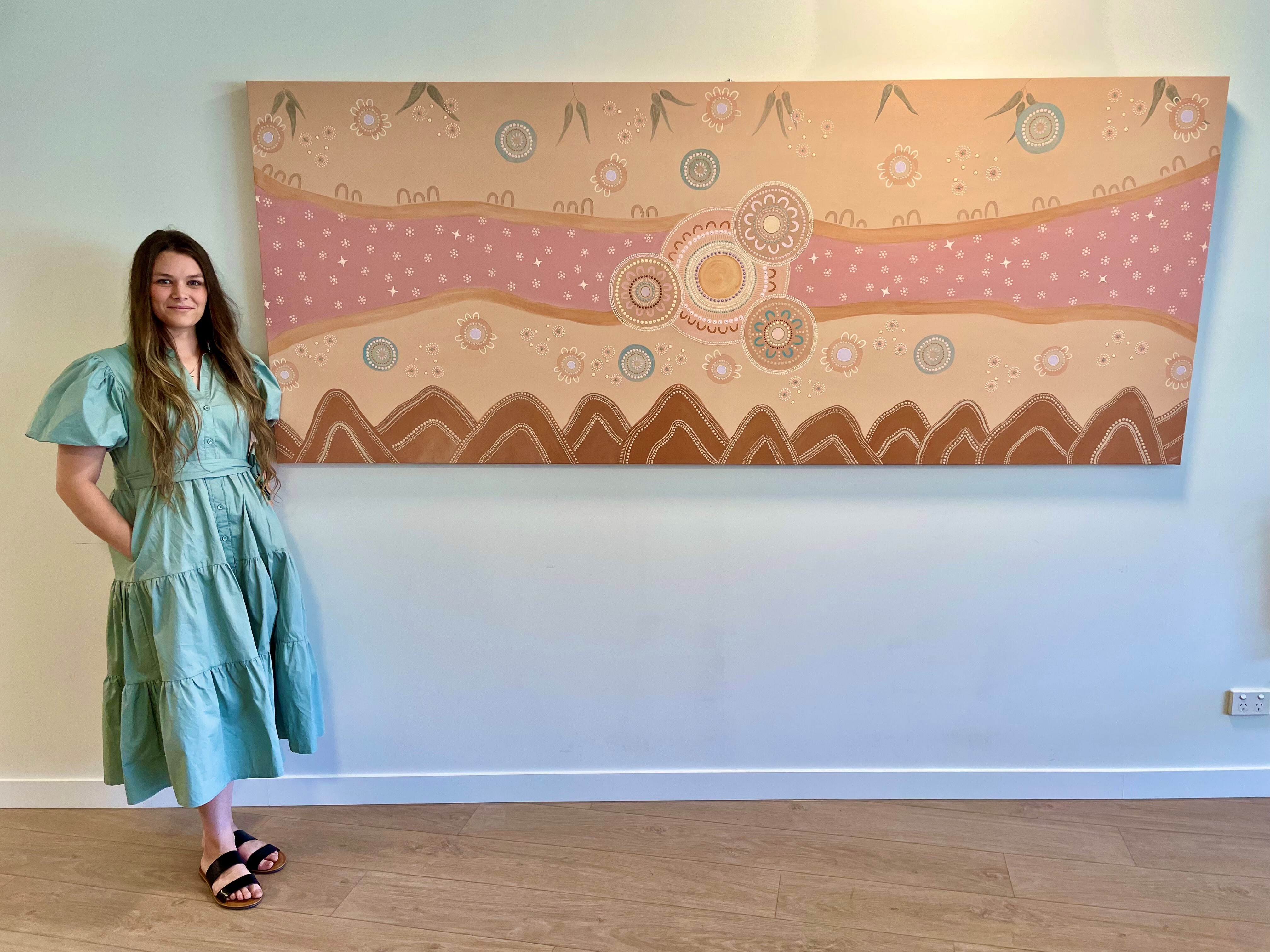 Artist Kyralee Shields pictured with her artwork "Gimbawali"